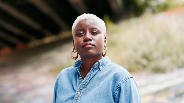 Headshot of Careese Dionne standing under an overpass