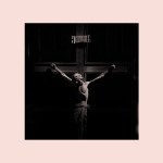 Jesus on the cross fading into shadow